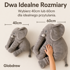 Różowa poduszka słoń umieszczona na dziecięcym łóżku