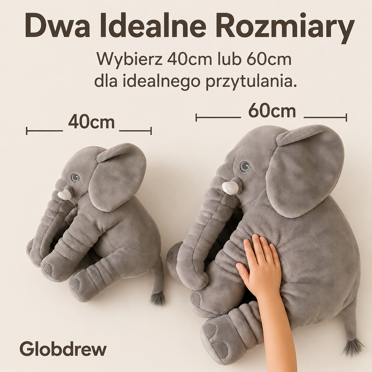 Różowa poduszka słoń umieszczona na dziecięcym łóżku