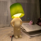 Lampa stołowa w kształcie figurki - plisowany klosz, kabel z tyłu